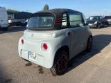 a small car that is parked in a parking lot