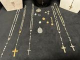 a table topped with lots of different types of jewelry on it