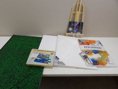 a table with a book and a pair of scissors on it