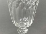 crystal wine goblet on a table with a gray background