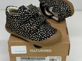 baby boy ' s black and white polka dotty shoes in a box