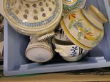 a blue box filled with different types of cups and saucers