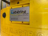 a close up of a yellow container with a sign on it