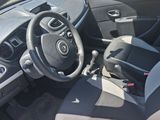 the interior of a small car with a steering wheel and dashboard