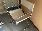 a chair that is in a room with a book shelf