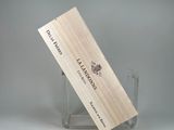 a wooden business card holder holding a wine bottle