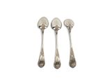 three silver spoons and a fork on a white surface