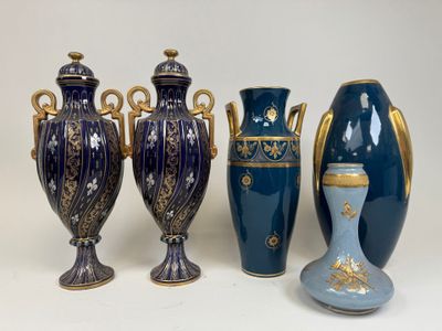 three vases and a vase on a table with a white background