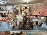 a display case with a lot of elephant figurines on it