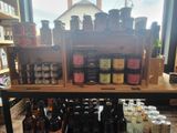 many bottles of beer on a shelf in a store