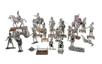silver figurines of knights and soldiers on a white background