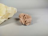 a small piece of rock next to a large piece of rock