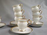 several cups and saucers are stacked on top of each other
