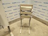 a machine that is sitting on a stand in a room