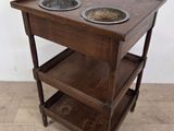a wooden table with two bowls on top of it