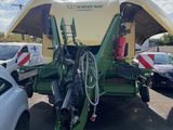 a picture of a tractor with a trailer attached to it ' s back