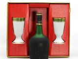 a bottle of wine and two cups in a box