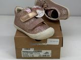 baby girl ' s shoes in a box on a white surface