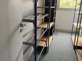 a room with shelves and a ladder in it