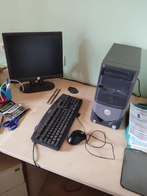 a desktop computer sitting on a desk with a keyboard and mouse