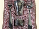 a box with silverware in it on a pink cloth
