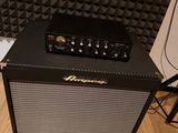a black amp sitting on top of a hard wood floor