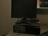 a desktop computer sitting on top of a desk next to a keyboard and mouse