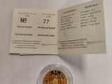 an image of a gold coin with a ticket on it