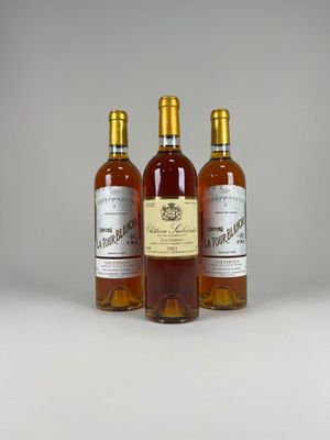three bottles of wine sitting next to each other on a table