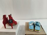pair of red and blue high heeled shoes sitting on top of a box