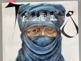 une photo d'un livre sur laquelle figure une femme portant un hijab bleu