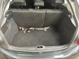 a trunk of a car that has a seat belt in it
