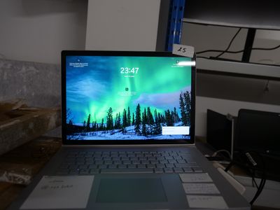 a laptop computer sitting on top of a desk