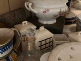 a lot of dishes on the counter in the kitchen