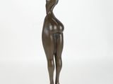 bronze statue of a woman holding her hands up in the air