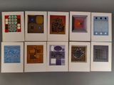 several cards with different designs on them on a gray surface