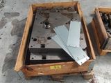 two wooden boxes with metal parts in them on the floor
