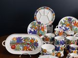 many different types of dishes and cups on the table