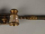 a small brass telescope with a glass on it