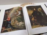 a book open to a painting of a man and a woman