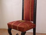a red and black chair sitting in a room