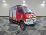 a red fire truck that is parked on a checkered floor