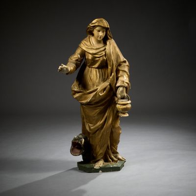 une image représentant une statue d'une femme tenant un seau