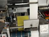 an image of a machine that is working on a piece of paper