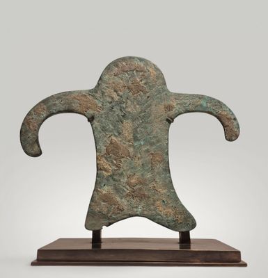 an image of a bronze statue of a man on a wooden base
