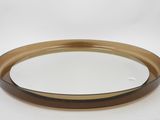 an image of a brown and white plate on a white surface