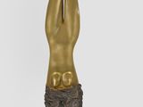 statue of a woman with her hands up in the air