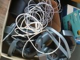 a box with a bunch of wires in it on the floor
