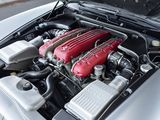 a close up of a car ' s engine with its hood open