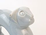 a blue statue of a dog on a white background